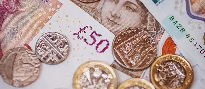 British Pound Gains Amid Weak USD, Positive UK PMI, and US Tariff Relief
